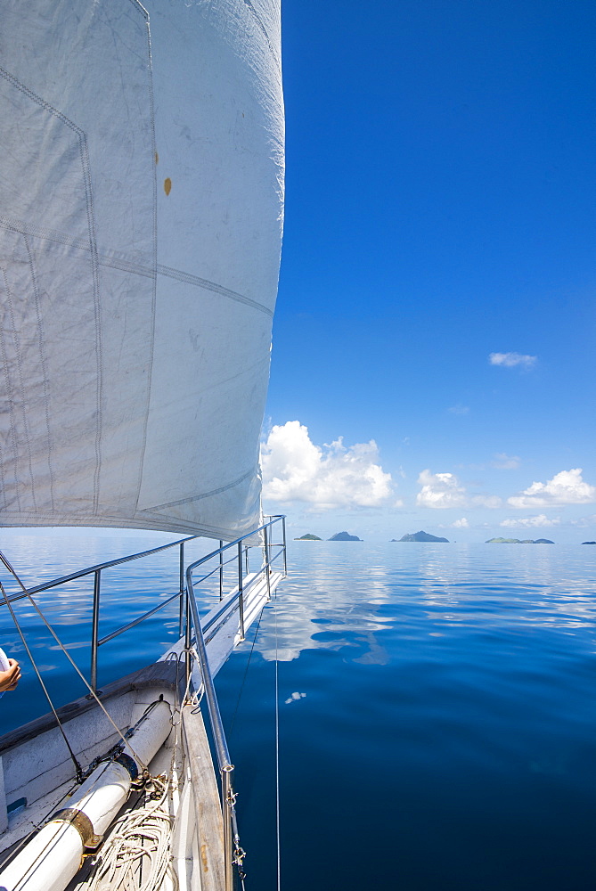 Sailing in the very flat waters of the Mamanuca Islands, Fiji, South Pacific