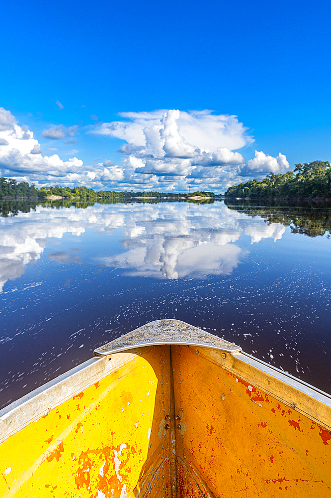 Clouds reflecting in the Rio Negro, southern Venezuela, South America