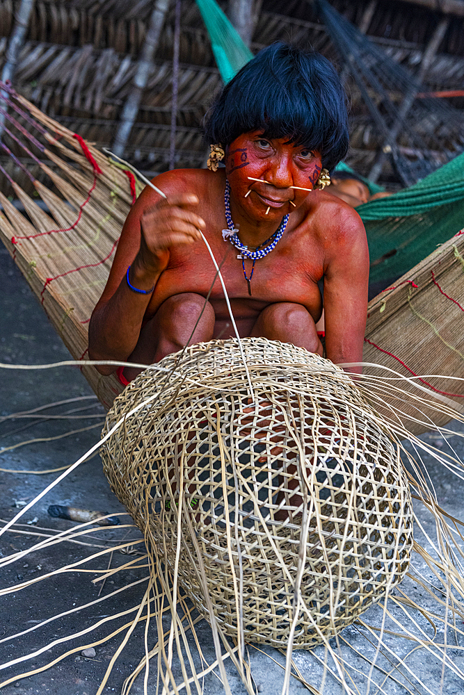 Woman from the Yanomami tribe weaving a basket, southern Venezuela, South America