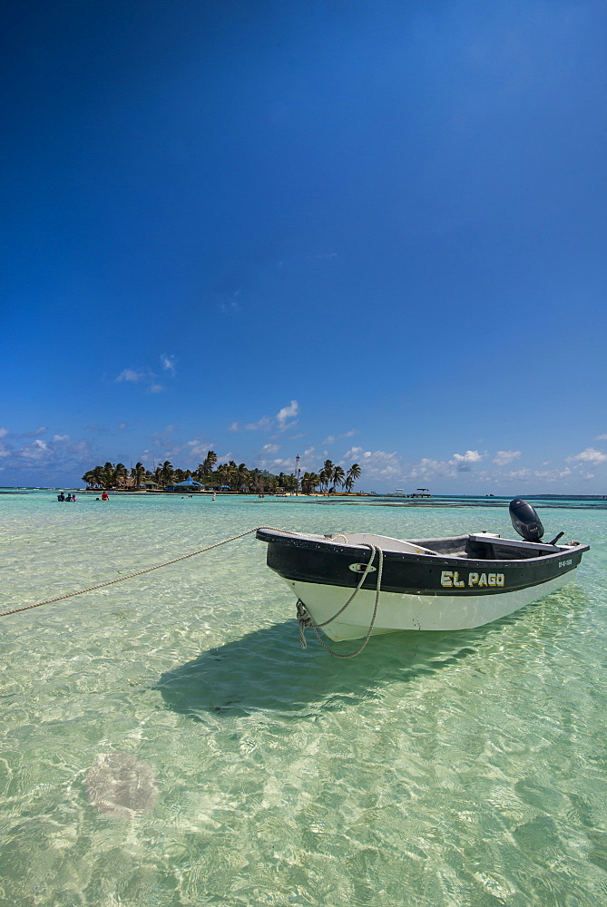 Motorboat anchoring in the turquoise waters of El Acuario, San Andres, Caribbean Sea, Colombia, South America