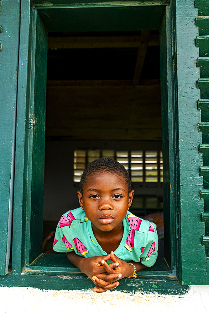 Young school kids looking out from a window, Ciudad de la Paz, Rio Muni, Equatorial Guinea, Africa