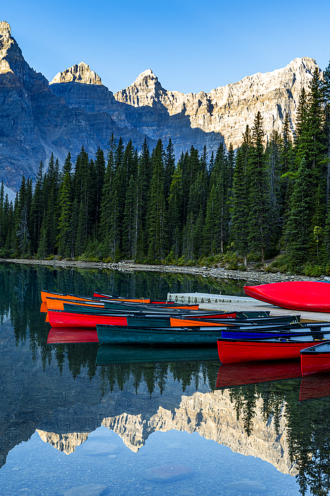 Canoes at sunrise at Lake Moraine, Banff National Park, UNESCO World Heritage Site, Alberta, Rocky Mountains, Canada, North America