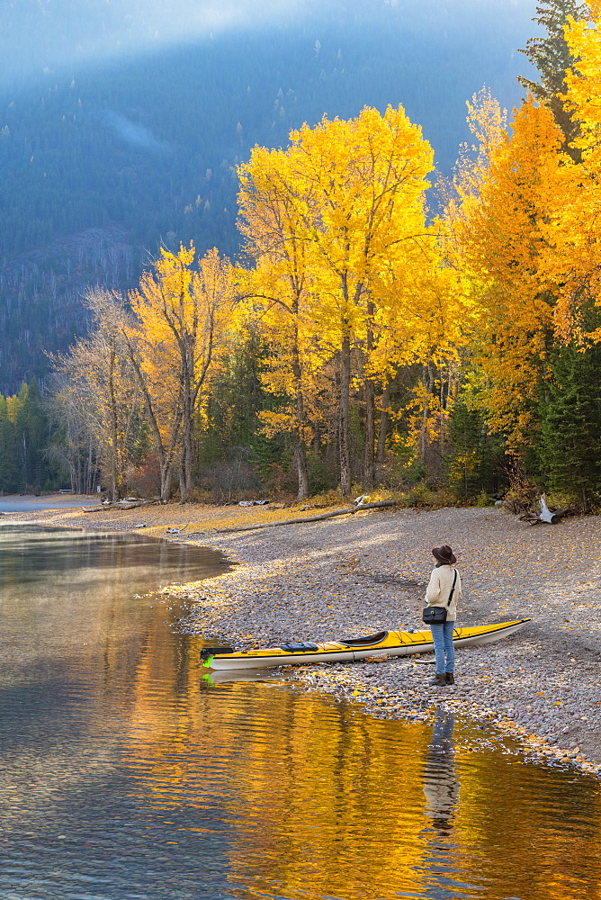 Woman on the shore of Lake McDonald, Glacier National Park, Montana, United States of America, North America