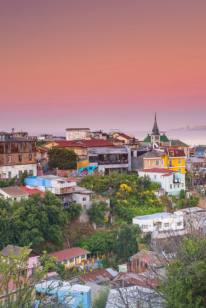 Sunset over the colourful buildings of Valparaiso, Chile, South America