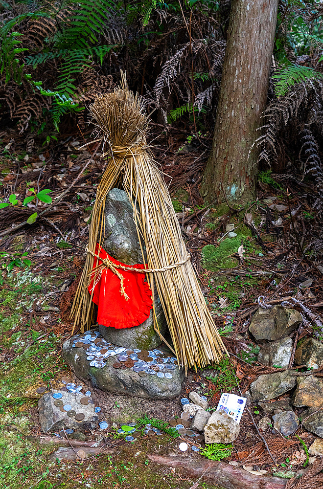 Small shrine with money offerings along the Kumano Kodo ancient pilgrimage route near Hongu, Honshu,  Japan, Asia