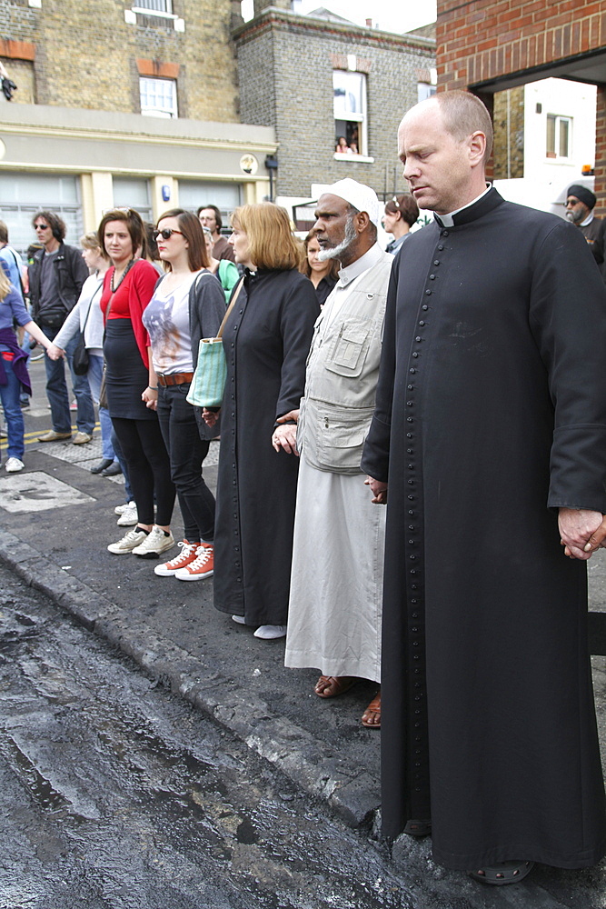 Local community get together to clear damage caused by rioters in hackney, london, uk