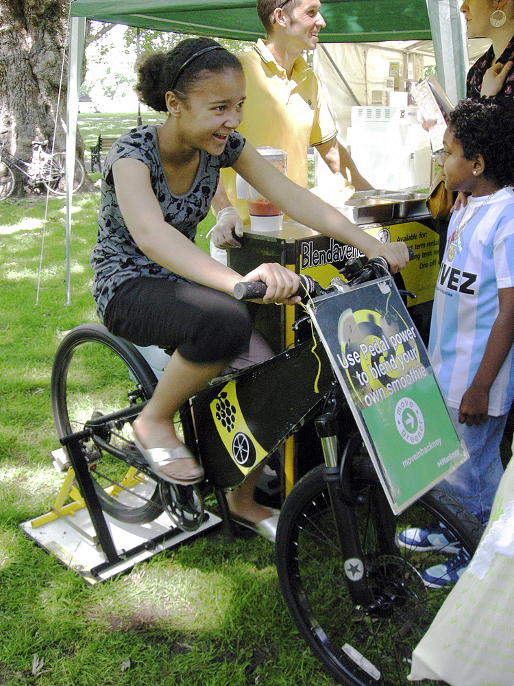 Pedalling for your juice at an ecological fair in hackney, london. England