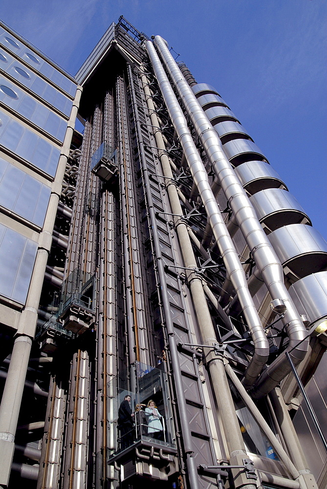 Uk staff using outdoor lifts to go to their offices at the lloyds hq in the city of london