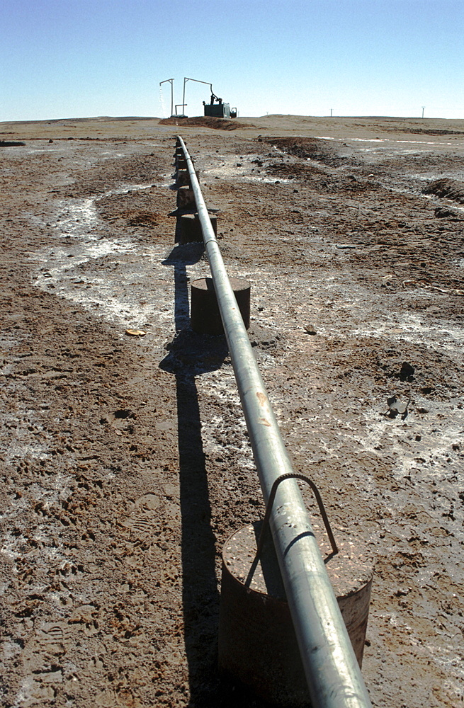 Western sahara. Lorries loading water from main pipe at polisario central camp.