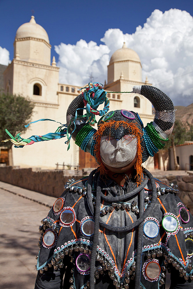 Reveller in costume and mask at Humahuaca carnival in Jujuy province in the Andes region of Argentina, South America