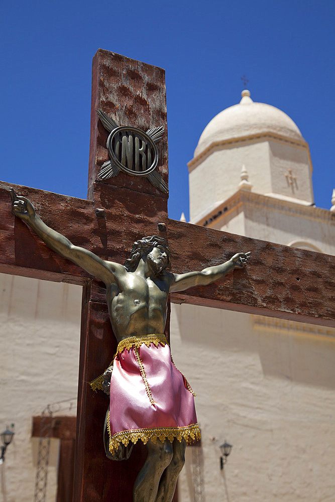 Traditional colonial church and crucifix in Humahuaca in Jujuy province in the Andes region of Argentina, South America