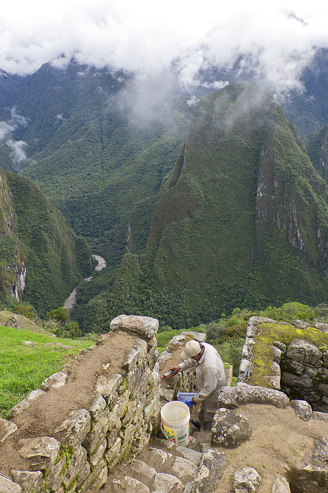 Restoration work at the Inca ruins of Machu Picchu, UNESCO World Heritage Site, Peru, South America