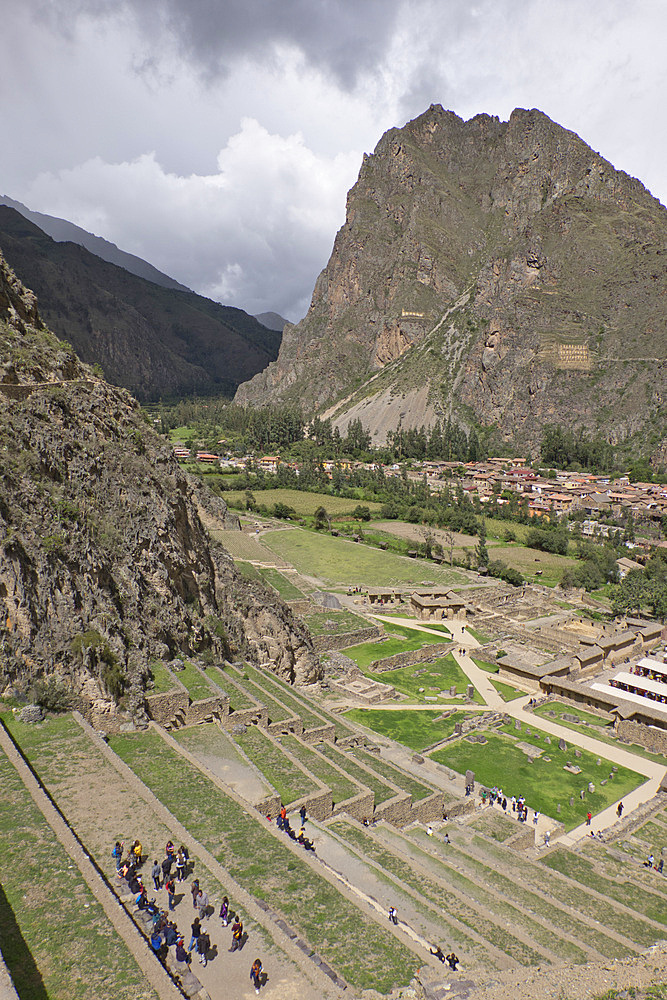 Tourists visit the ruins of the Inca archaeological site of Ollantaytambo near Cusco. Peru, South America