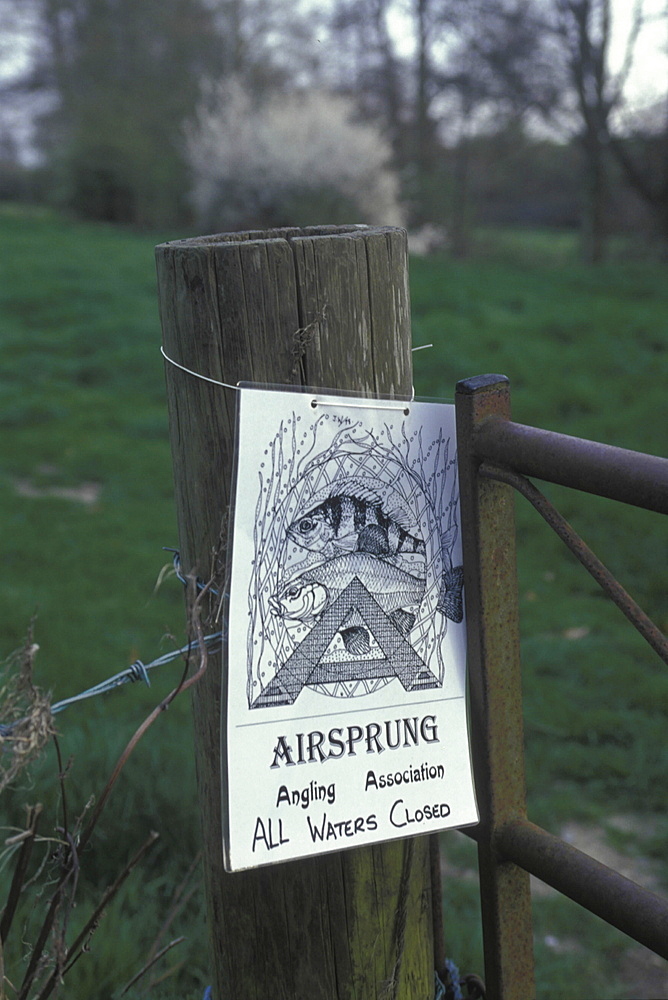 Water pollution, uk somerset. Warning signs for polluted water on the frome river