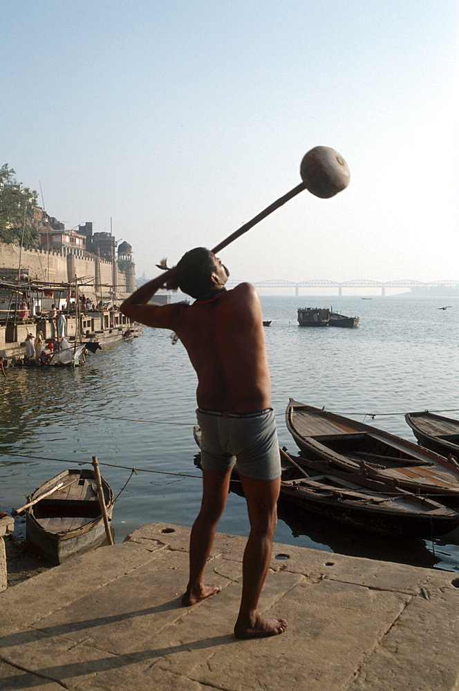 India, varanasi, wrestlers on the banks of the holy ganges river.