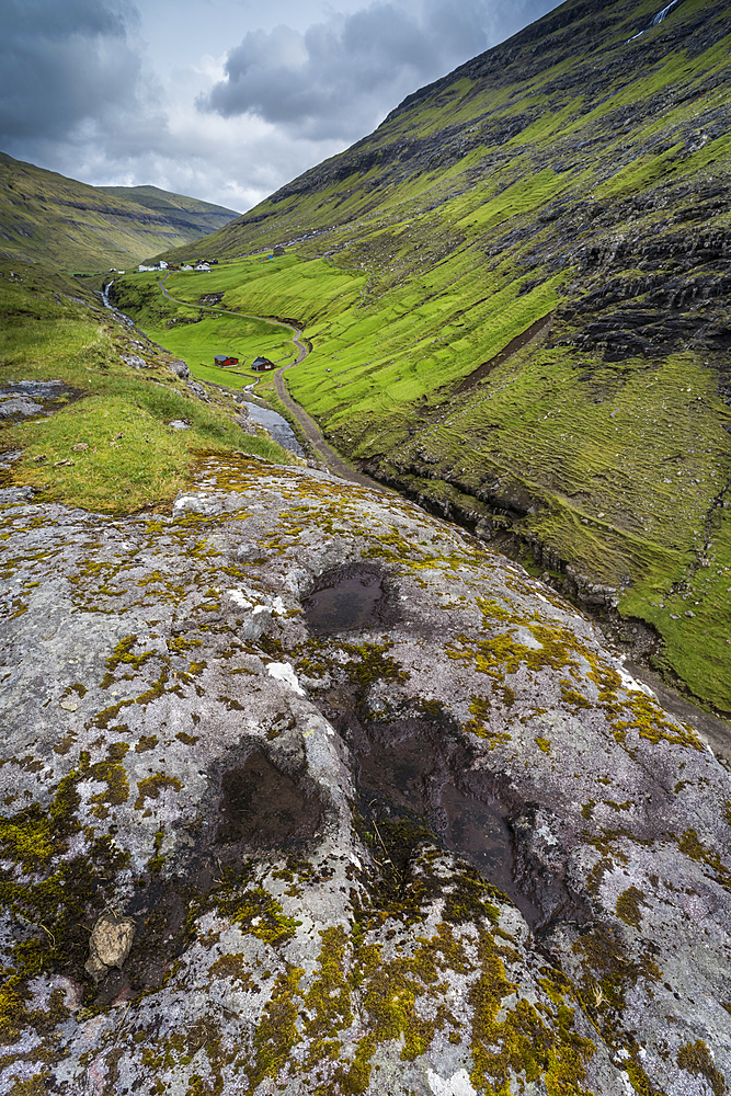 Lichen covered rock and valley, Saksun, Faroe Islands, Denmark, Atlantic, Europe