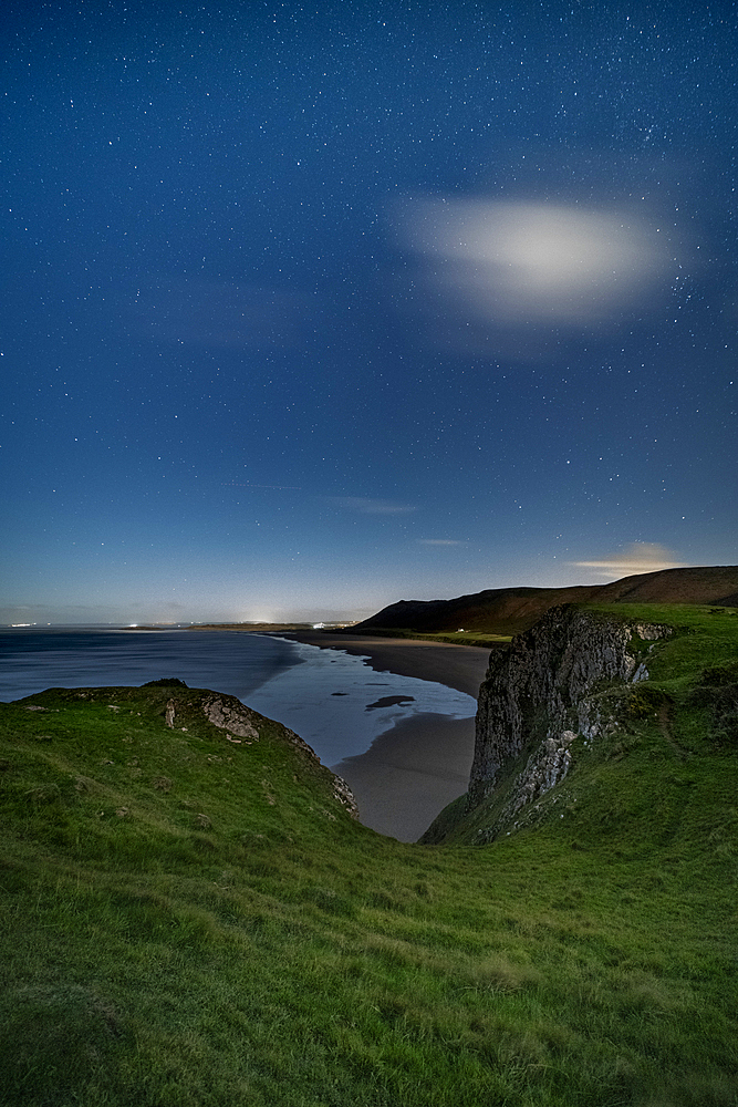 Worms Head and Rhossili beach under moonlight, Gower, South Wales, United Kingdom, Europe