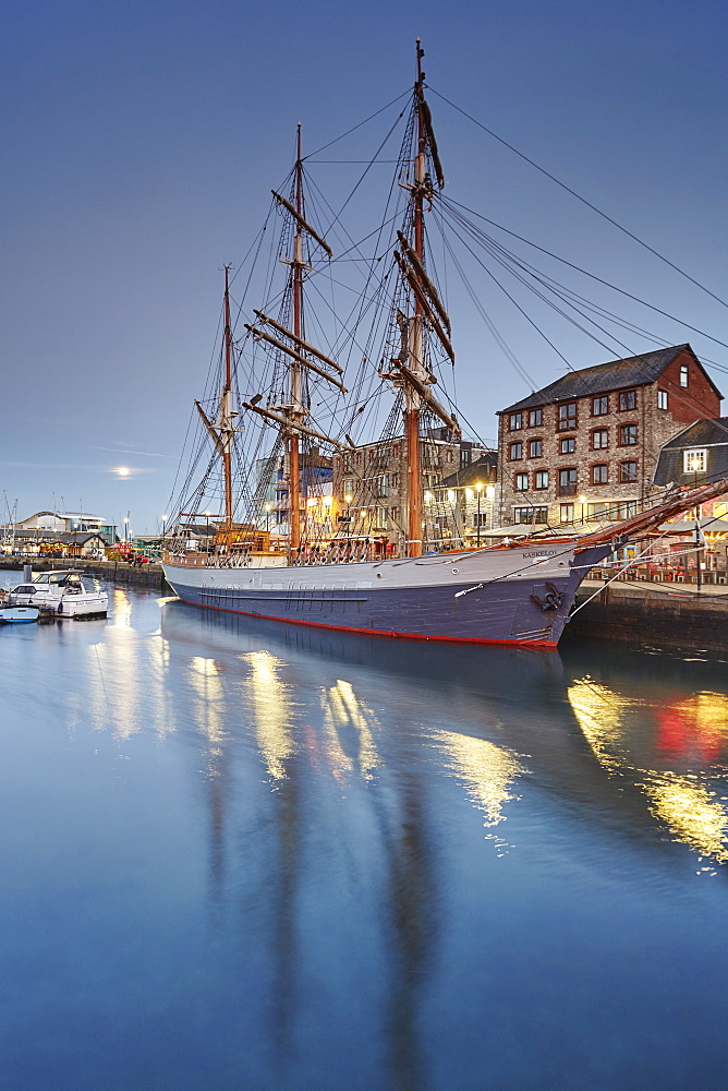 An atmospheric dusk at Sutton Harbour and the Barbican, the historic and tourism heart of the city of Plymouth, Devon, England, United Kingdom, Europe