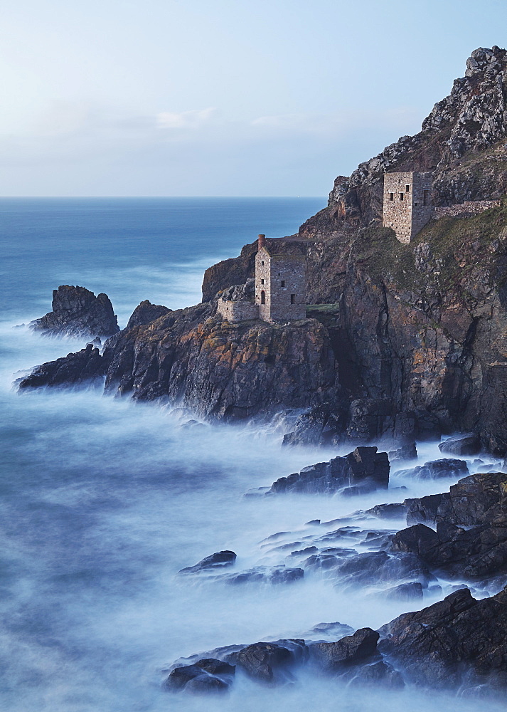 A dusk view of the iconic cliffside ruins of Botallack tin mine, UNESCO World Heritage Site, near St. Just, near Penzance, in west Cornwall, England, United Kingdom, Europe