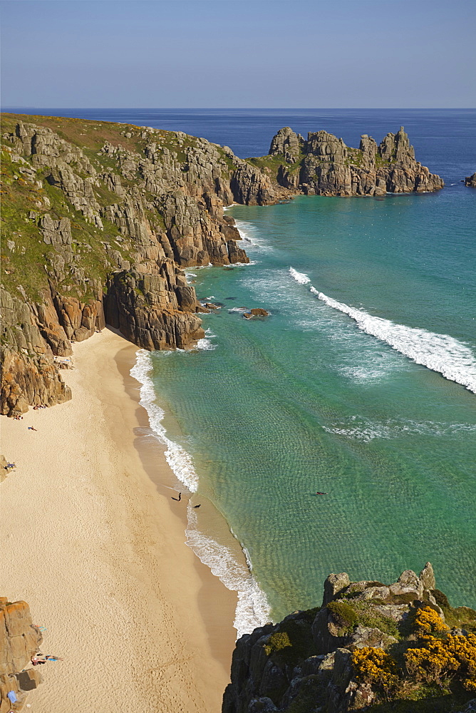 Iconic view from Treen cliffs, across the sands of Pedn Vaunder to the Logan Rock headland, near Penzance, Cornwall, England, United Kingdom, Europe