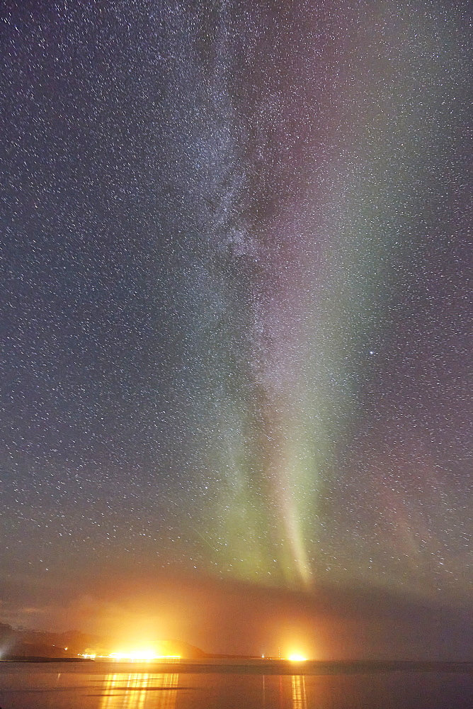 The Aurora Borealis (Northern Lights) seen over Olafsvik and Rif, on the right, Snaefellsnes peninsula, western Iceland, Polar Regions