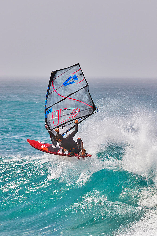 Wind-surfing on Atlantic rollers at Ponta Preta, southwest coast of Sal, Cape Verde Islands, Atlantic, Africa