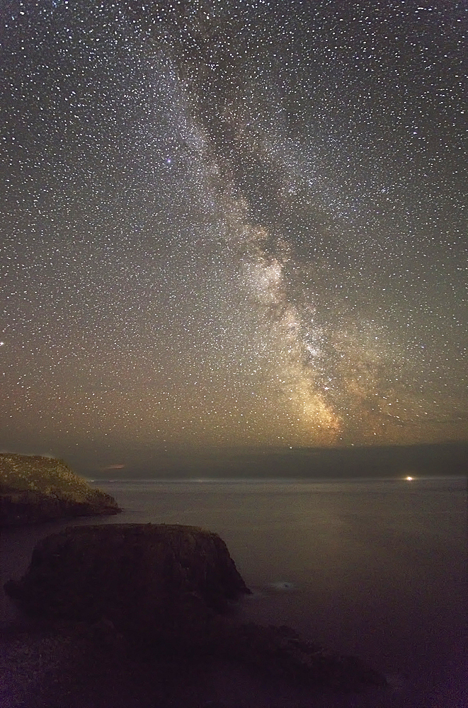 An autumn view of the Milky Way over the Atlantic Ocean, seen from the cliffs of Land's End, the most southwesterly point of Great Britain, Cornwall, England, United Kingdom, Europe