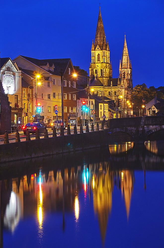 A dusk view of St. Fin Barre's Cathedral, on the banks of the Lee River, in Cork, County Cork, Munster, Republic of Ireland, Europe