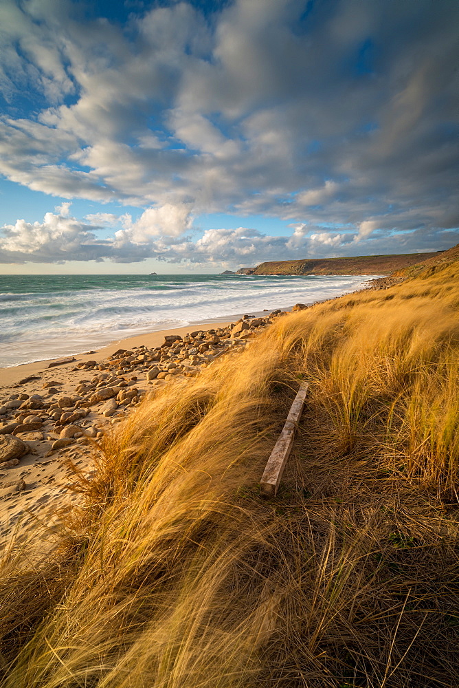 Fence post in foreground, with Brissons and Cape Cornwall in the far distance, Sennen Beach, Sennen, Cornwall, England, United Kingdom, Europe