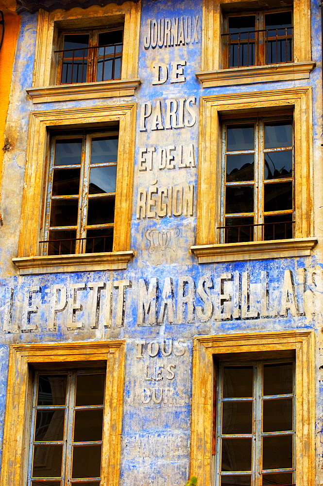 Old newspaper mural advert, Provence, France, Europe