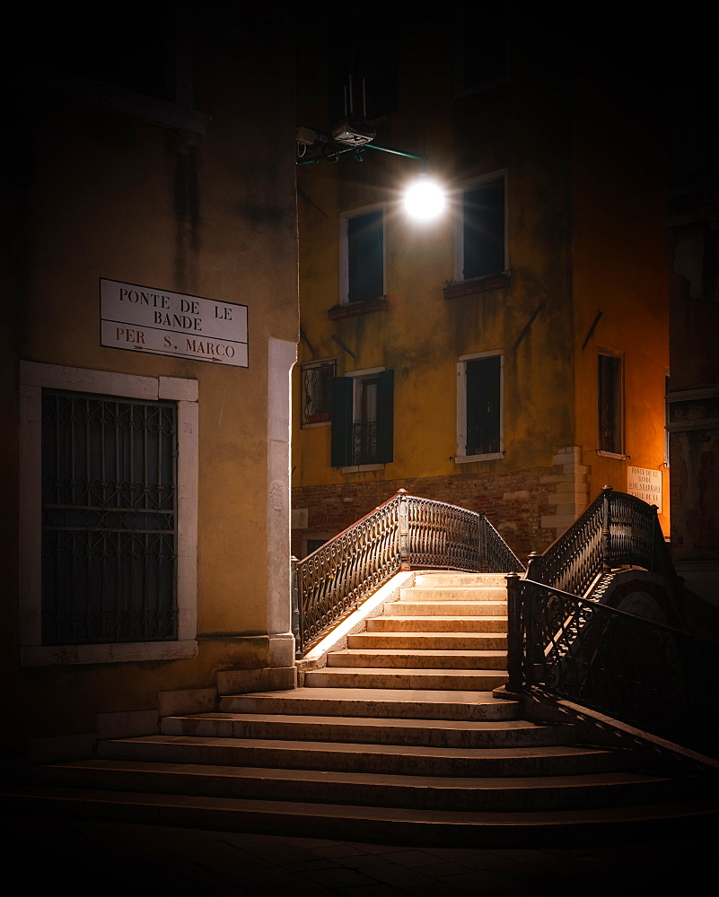 Street light over bridge at night on Ponte de la Bande, Venice, Italy, Europe