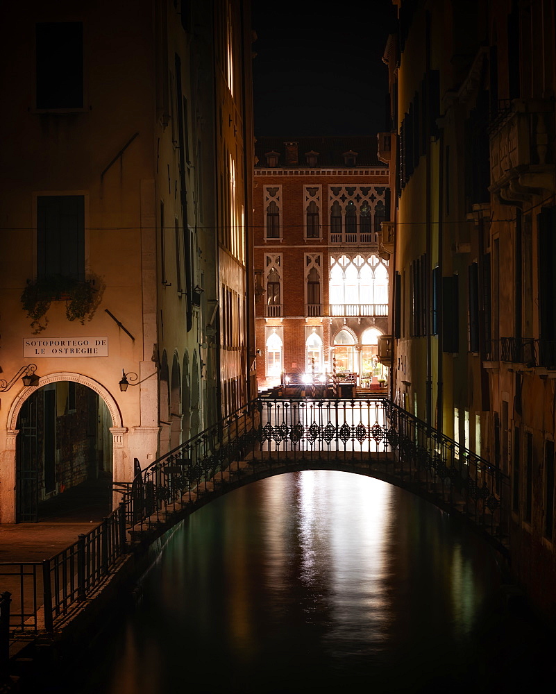 Bridge over canal at night in Venice, Italy, Europe