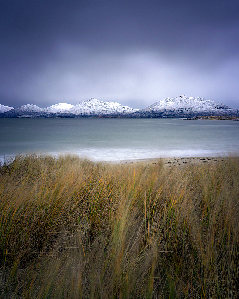 Winter at Luskentyre beach with snow capped mountains, Isle of Harris, Outer Hebrides, Scotland, United Kingdom, Europe