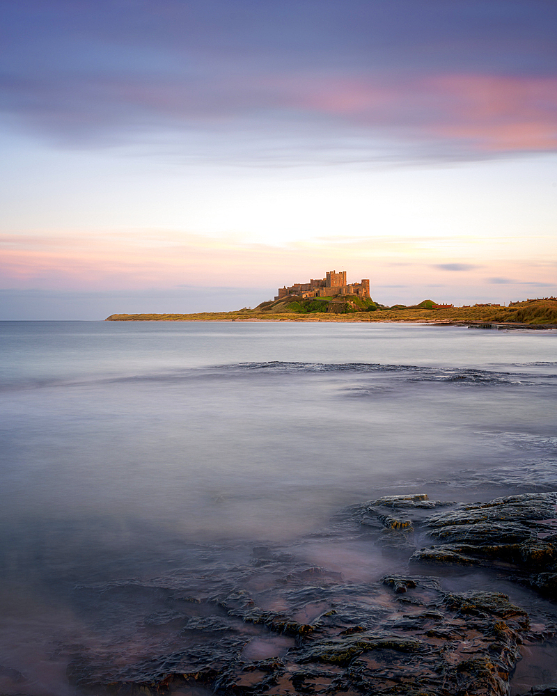 Bamburgh castle at sunset, Bamburgh, Northumberland, England, UK