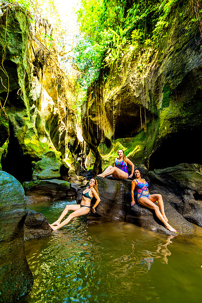 Women posing for a picture at the Beji Guwang Hidden Canyon, Bali, Indonesia, Southeast Asia, Asia