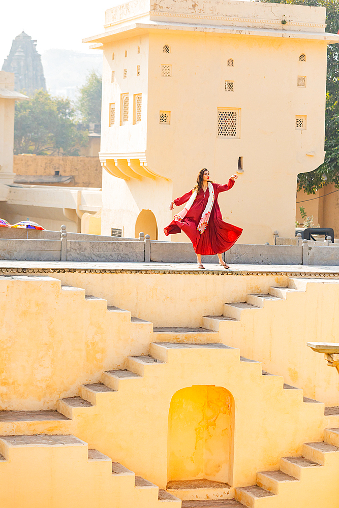 Woman in red garment at Panna Meena ka Kund, Jaipur, Rajasthan, India, Asia