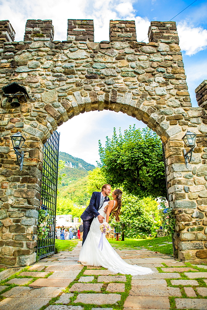 Couple, bride and groom, posing at the Castello di Rossino, Lake Como, Lombardy, Italy, Europe