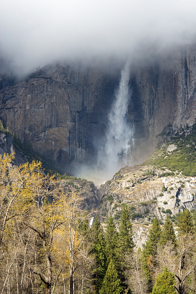 Waterfall emerging from clouds from El Capitan in Yosemite National Park, UNESCO World Heritage Site, California, United States of America, North America