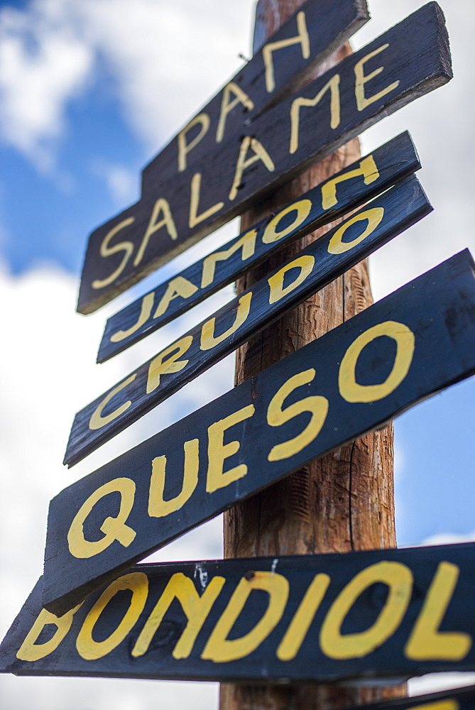 A sign outisde a cafe in Patagonia advertises the menu in Spanish, Argentina, South America