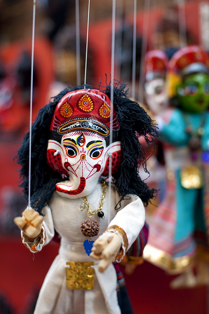 Colourful puppets hanging on display in the historical Newar city of Bhaktapur, Nepal, Asia