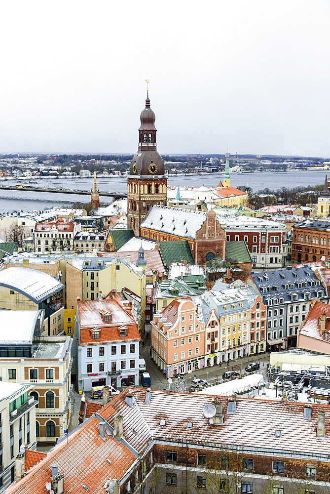 View over Riga Old Town city centre and Daugava River, with snow covered rooftops, UNESCO World Heritage Site, Riga, Latvia, Europe