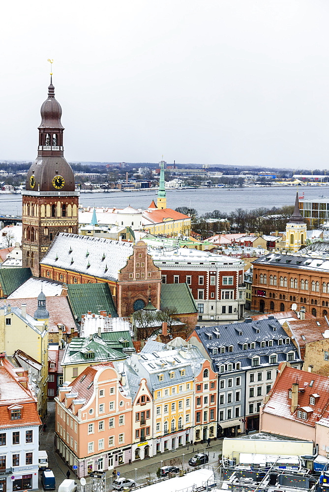 View over Riga Old Town city centre and Daugava River, with snow covered rooftops, UNESCO World Heritage Site, Riga, Latvia, Europe