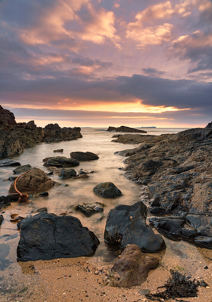 Dawn breaking over Bamburgh beach and the Farne Islands, Northumberland, England, United Kingdom, Europe