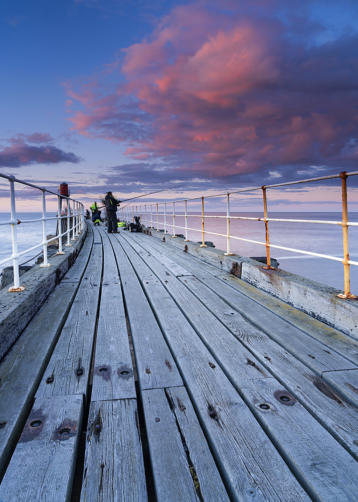 Whitby piers and harbour at dusk, Whitby, the North Yorshire coast, Yorkshire, England, United Kingdom, Europe