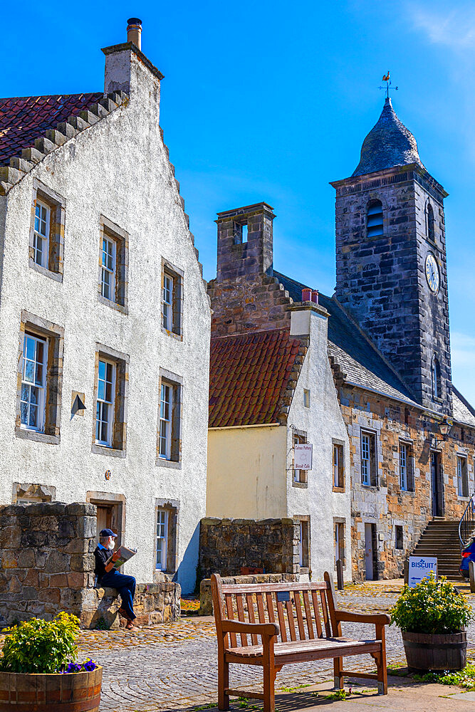 Elderly person reading, Culross, Fife, Scotland, United Kingdom, Europe