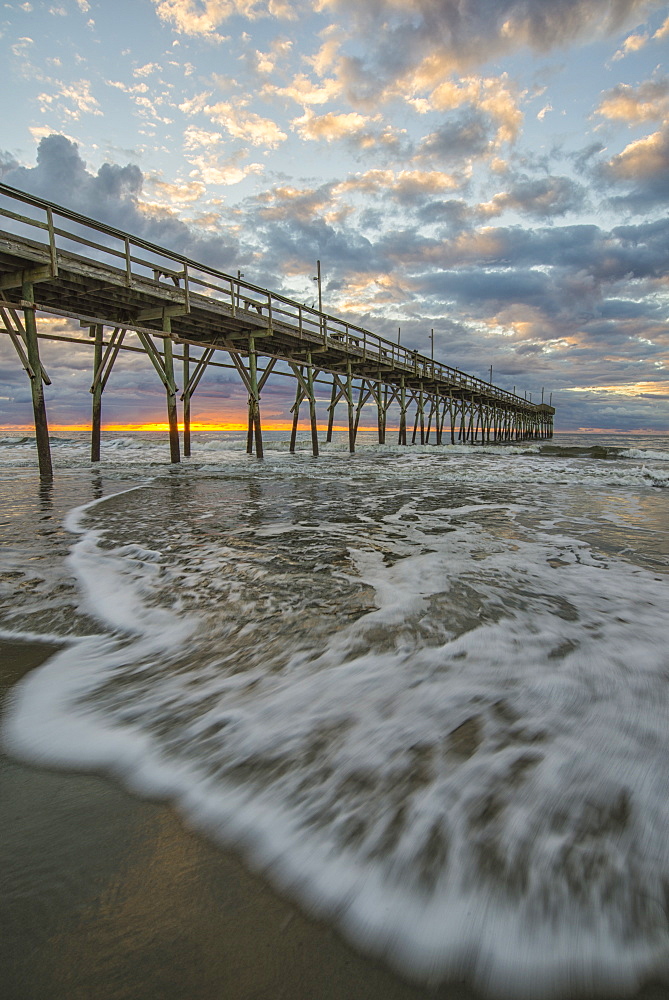 Beach, ocean, waves and pier at sunrise, Sunset Beach, North Carolina, United States of America, North America