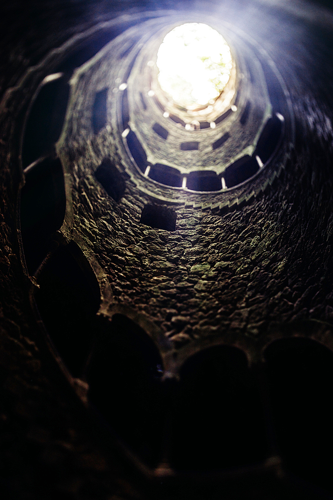 View of spiral staircases at the Initiation Well, purportedly used for ceremonial purposes by Freemasons in the 19th century, at Quinta da Regaleira, Sintra, Portugal, Europe