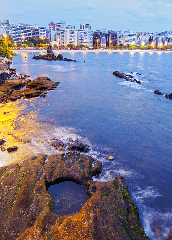 Twilight view towards Icarai Beach with skyline of Niteroi, Niteroi, Rio de Janeiro, Brazil, South America