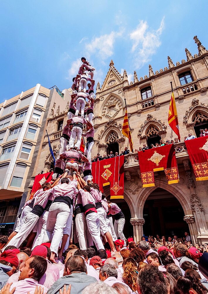 Castell human tower in front of the City Hall during the Festa Major Festival, Terrassa, Catalonia, Spain, Europe