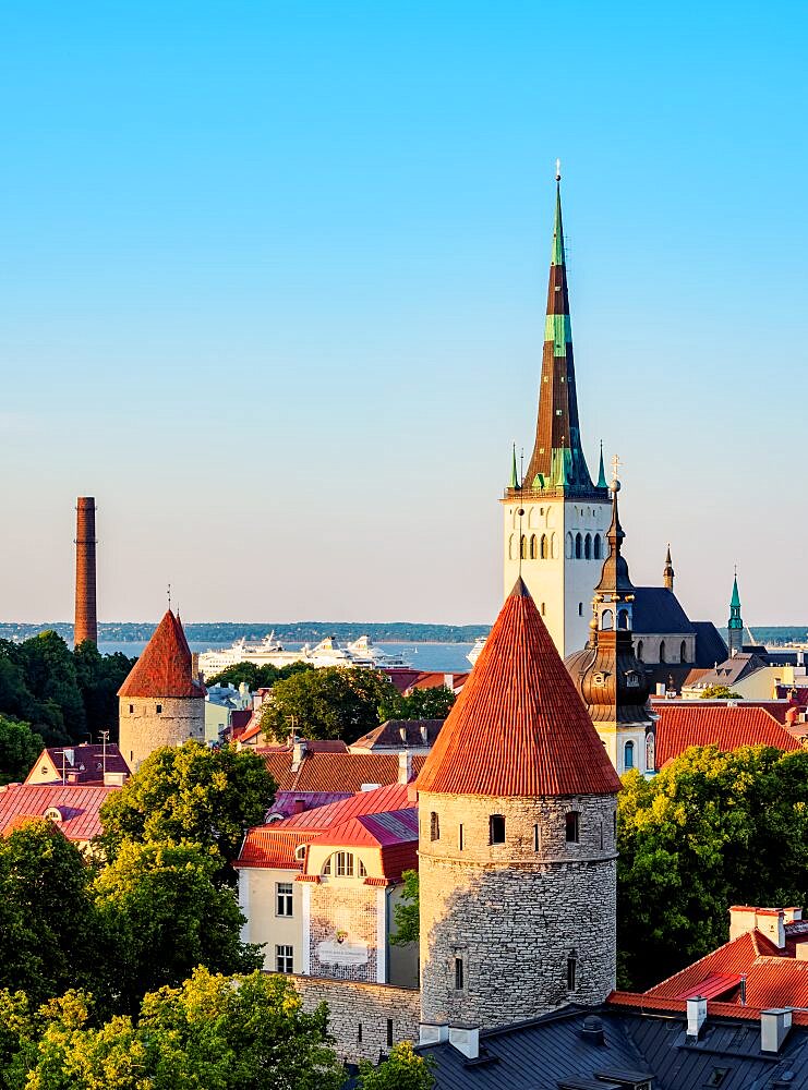 View over the Old Town towards St Olaf's Church at sunset, Tallinn, Estonia